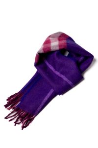 A close-up image of the 'Baby Alpaca Scarf: Elegant Orchid' featuring a purple scarf with white stripes and pink square accents.